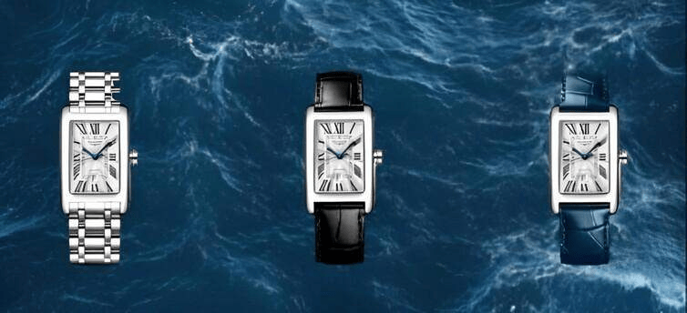 นาฬิกาสามรุ่น ตัวเรือนสี่เหลี่ยมสีเงิน หน้าปัดสีขาว เข็มสีน้ำเงิน หนึ่งบนสายเงิน หนึ่งบนสายสีน้ำเงินเข้ม และอีกหนึ่งบนสายสีดำ